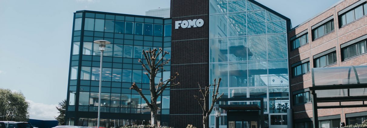 Fomo Works' building is covered with red bricks and glass walls. It is situated right next to Ikea and highway E39.